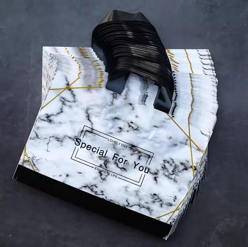 

50 шт., новые модели, сумки толщиной 0,14 мм, прочная одежда, косметический подарок, сумки для покупок, эластичные, мощные, портативные, портативные упаковочные сумки 35x25x10cm