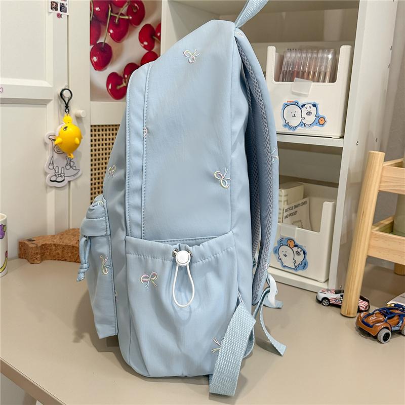 Zaino scolastico carino con ricamo a fiocco, tasca frontale, manico superiore, zainetto casual per uso quotidiano