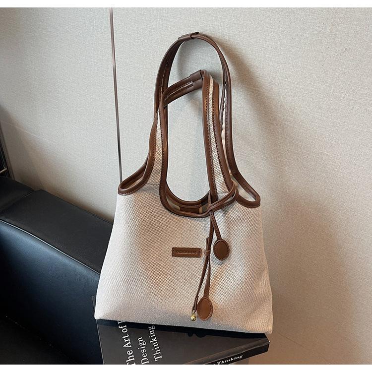 2025 new niche shoulder bag fashionable simple tote bag large capacity commuter handheld canvas bag women