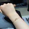Exquisite Gold-Plated Copper Bracelet with Diamond-Studded Three-Leaf Clover Design