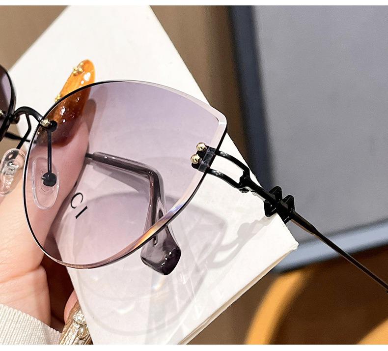 Women's Frameless Oval Metal Retro Sunglasses - High-End Japanese & Korean Fashion