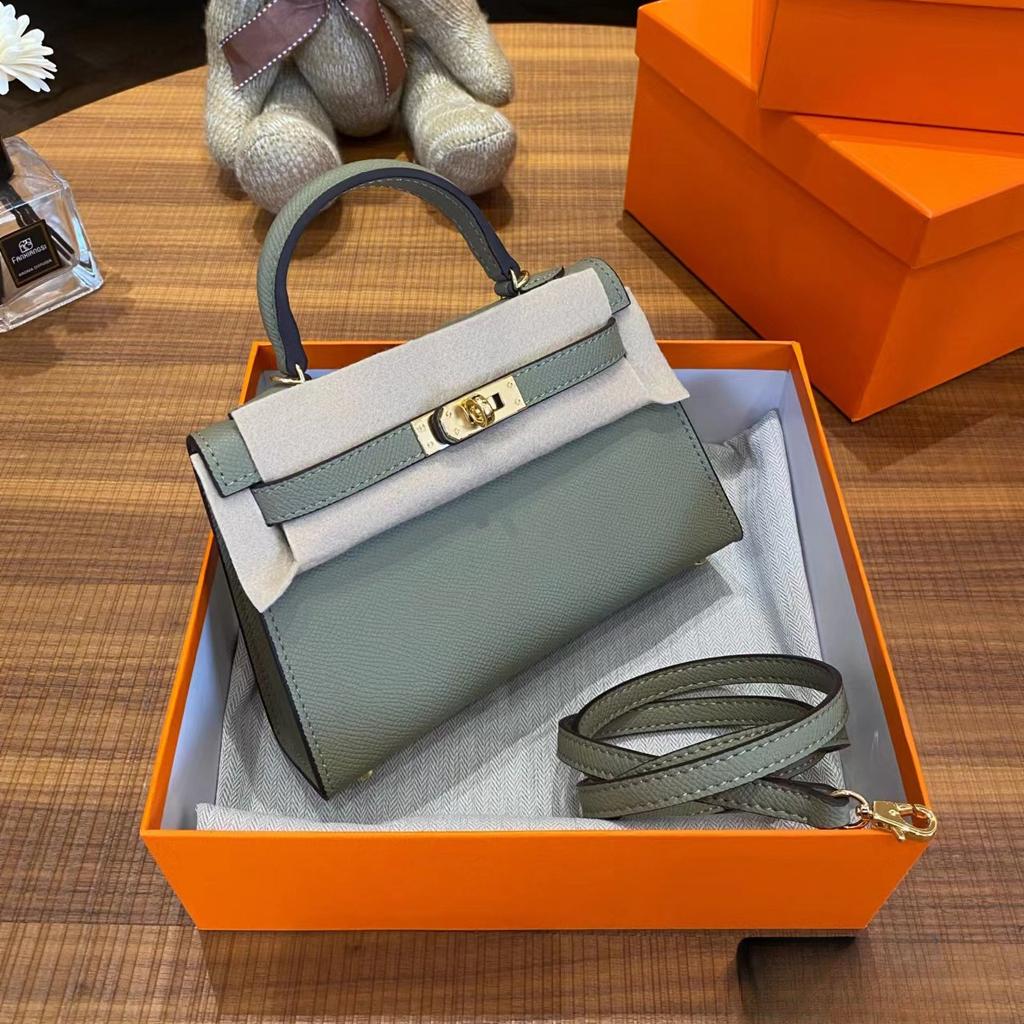 Grenzüberschreitende Hersteller Großhandel Damenhandtaschen 2023 neue Handtaschen aus Leder mit Palmenmuster tragbare Schulter-Umhängetaschen Damenhandtaschen große Kapazität