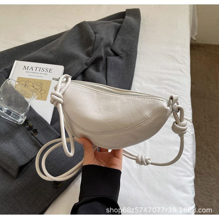 Niche design dumpling bag female messenger bag 2025 new high-end retro casual mobile phone bag fashion commuter bag