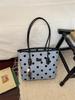 Stylish Polka Dot Large Capacity Tote: Versatile, Fashionable Handheld & Shoulder Bag for Commuting.