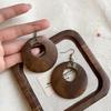 New Chinese wood hollow round pendant earrings fashionable retro simple ear hook niche high-end earrings