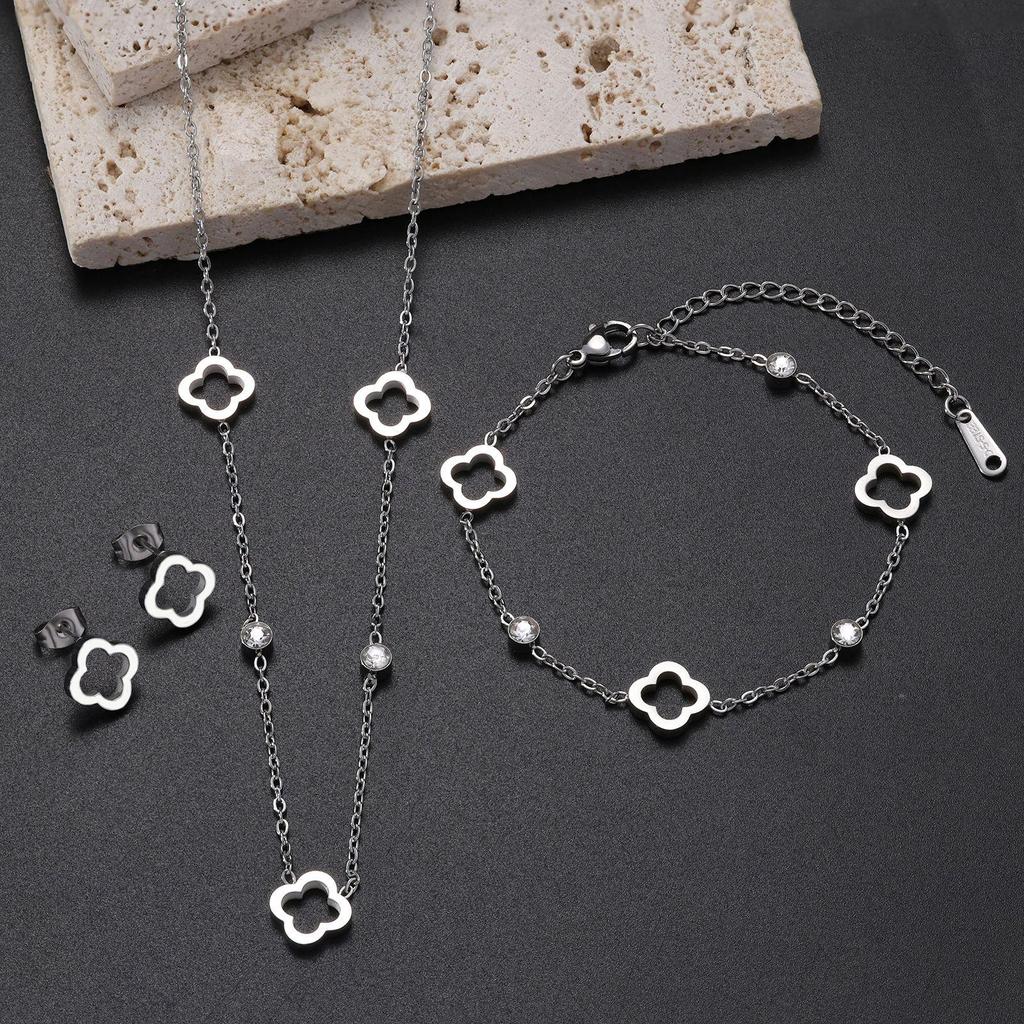 18K Gold Four-Leaf Clover Jewelry Set: Necklace, Bracelet, and Earrings in Titanium Steel with Zirconia.