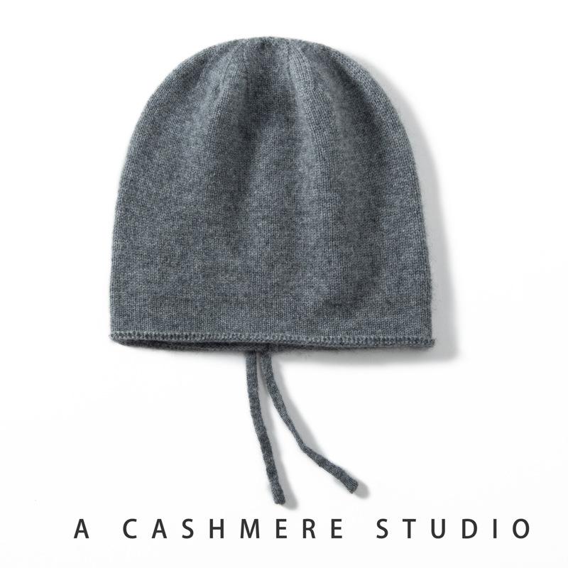 Autumn and Winter New Cashmere Women's Knitted Hat Drawstring Warm Ear Protection Fashion Hat Crimping Stack Hat Cold Hat
