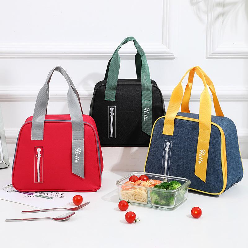 Stylish Oxford Cloth Thermal Lunch Bag - Trapezoidal, Large Capacity, Foldable, Handheld Bento Bag for Students.