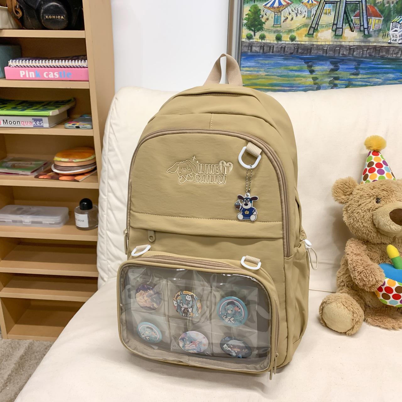 

Junior high school student schoolbag campus versatile simple backpack large capacity spine protection light backpack pain bag Japanese travel bag Send random badges plus small pendants хаки