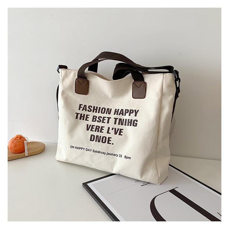 Simple canvas large-capacity casual bag women's 2025 new lazy style single shoulder fashion printed letter tote bag