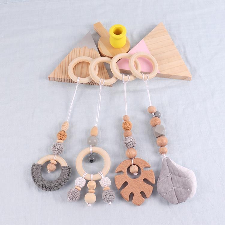 China Manufacturer Exquisite Color Leaf Four-piece Fitness Rack Pendant Wooden Baby Play Activity Gym