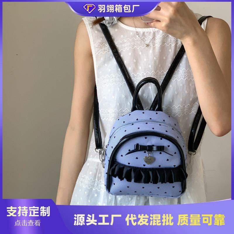 New college student schoolbag female junior high school student fashion polka dot backpack simple large capacity class commuter back