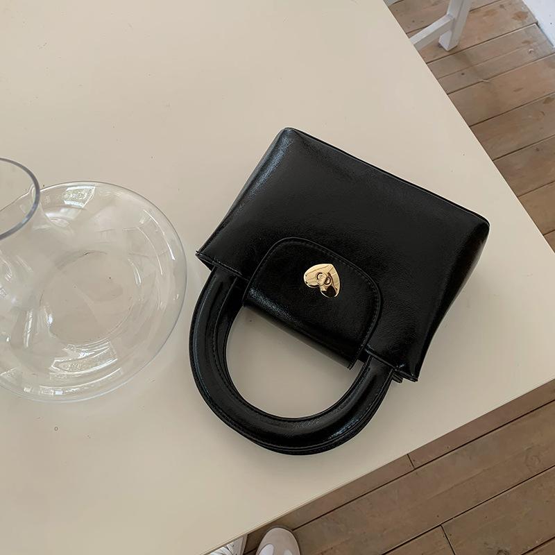 Korean Niche Love Lock Handbag Ins Women's Bag Texture Quality Casual and Durable Material Fashionable One-shoulder Cross-slide Bag