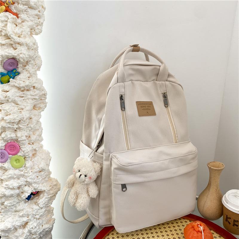Korean version of schoolbag female college student versatile large-capacity portable lightweight and simple junior high school student travel backpack