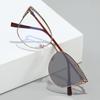 Trendy Cat-Eye Color-Changing Blue Light Glasses for Women with Rhinestone Inlay, Luxury Metal Style, and Optional Prescription Lenses.