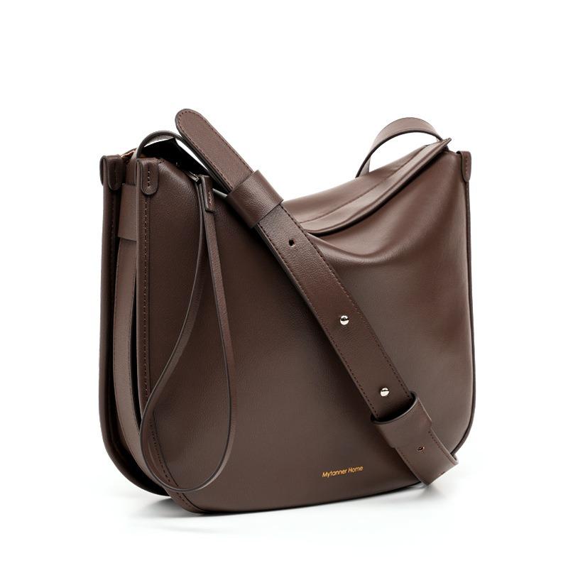 

Niche messenger tote bag women s large-capacity commuter bag new shoulder versatile underarm bag cowhide saddle bag темно-коричневого