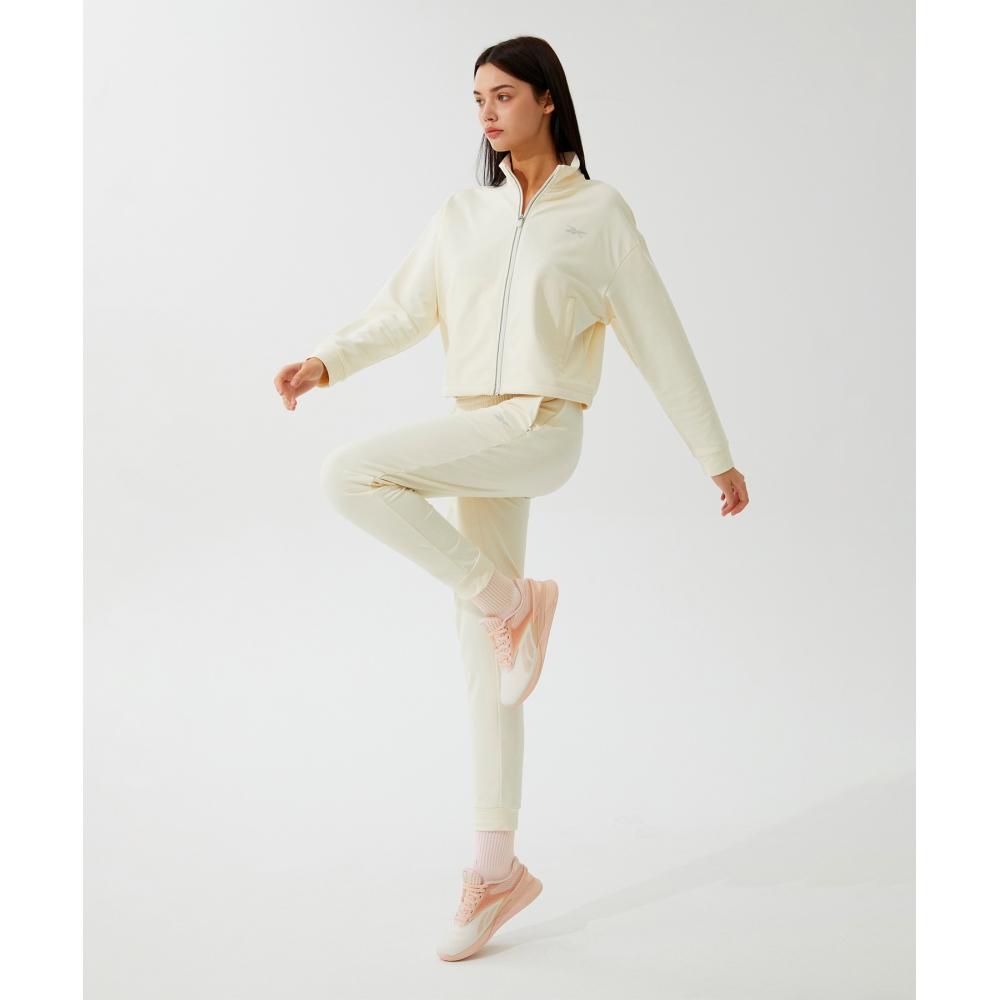 

Тренировочные брюки REEBOK Active Brushed W цвета слоновой кости 70