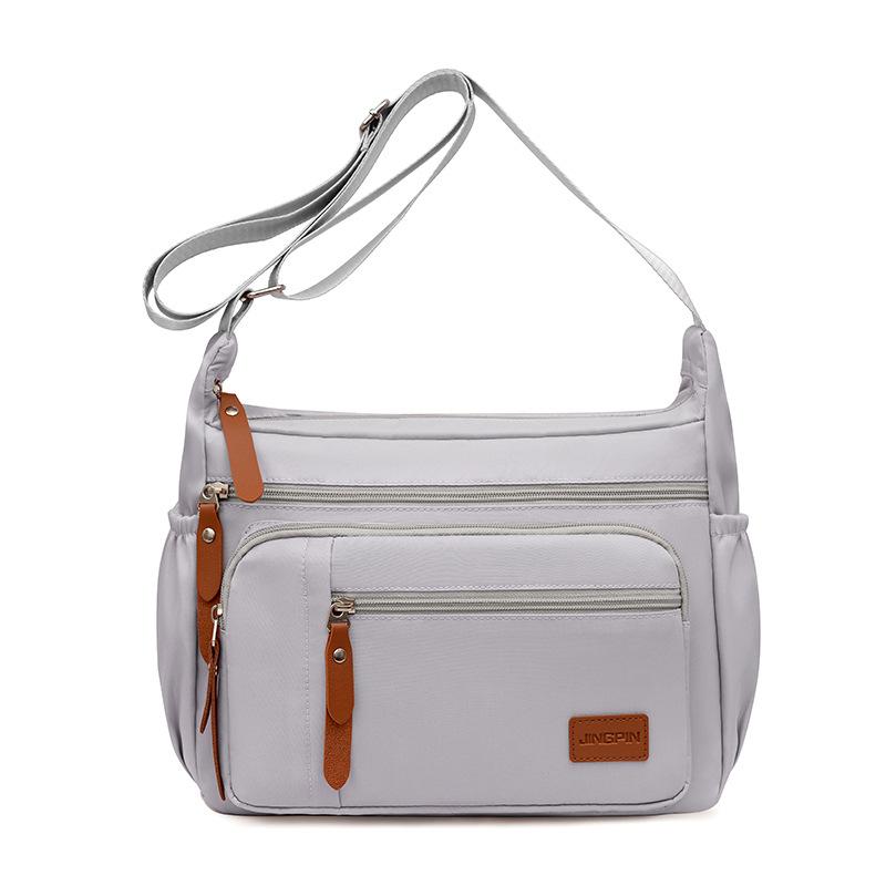 

Корейская версия модной водонепроницаемой сумки через плечо из ткани Оксфорд, новая женская повседневная сумка через плечо, сумка большой вместимости, холщовая сумка 26x31x10cm