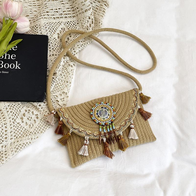

National beach woven bag women s summer new contrasting color fringed straw woven casual shoulder messenger bag