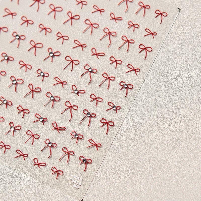 

Nail Sticker Tomoni Embossed Adhesive Japanese Style Bright Crystal Small red Bows 3656