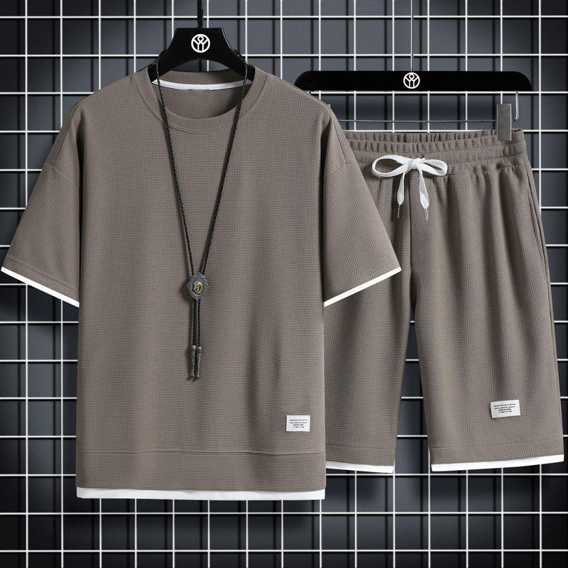 Letni męski dwuczęściowy zestaw tkanina lniana luźna koszulka i zestaw szortów męski strój sportowy moda dres z krótkim rękawem garnitury męskie