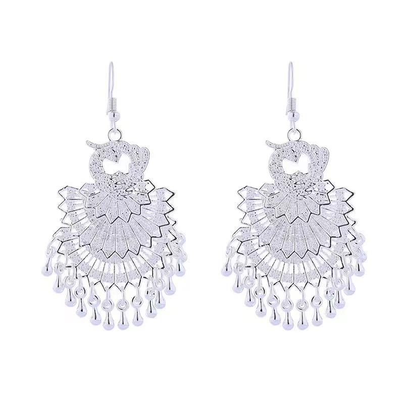Bohemian Ethnic Miao Silver Tassel Earrings with Butterfly, Peacock, and Flower Design for Women – Long Dangle Jewelry for Travel Photos.