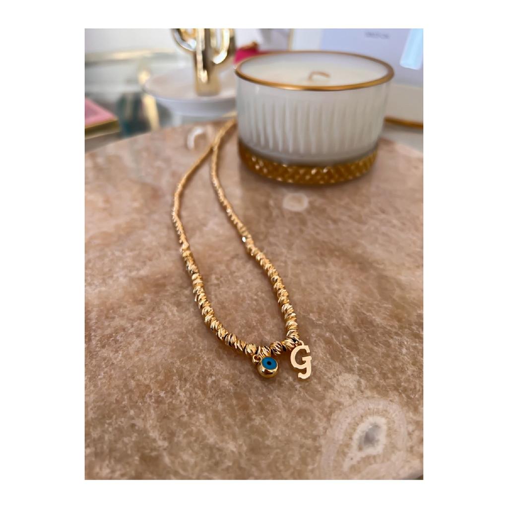 Colier Dorica cu litera G și detaliu de ochi rău