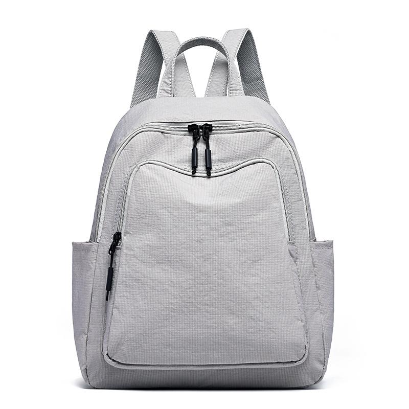 Schoolbag1011 New Simple Casual Backpack Women's Versatile Commuter Large Capacity Backpack Go Out and Play Lightweight Mountaineering Bag