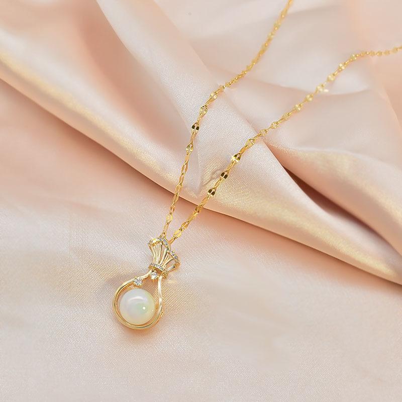 

Ожерелье с жемчугом русалки, женское, в стиле кантри, с подвеской в виде мешочка с деньгами, титановая сталь, цепочка для ключиц, тот же стиль