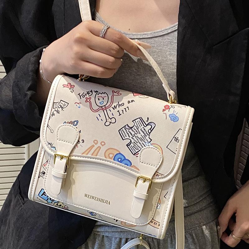 Korean version of college style cute cartoon handbag women 2025 new fashion casual simple backpack student schoolbag