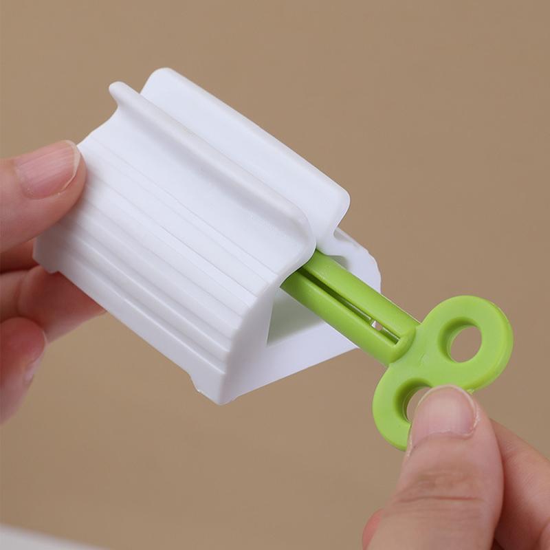 Mini-Zahnpastapresse, manueller Tubenspenderhalter, multifunktionaler Badezimmer-Zahnpasta-Gesichtsreiniger-Presswerkzeug