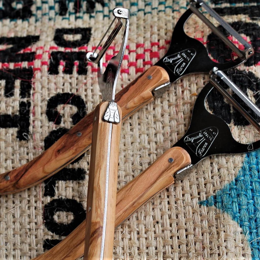 The NERON Peeler Features a Comfortable Wooden Handle and Laguiole Olive Made In This Peeler Combines the Elegant Design and Artisanal Sharpness of a