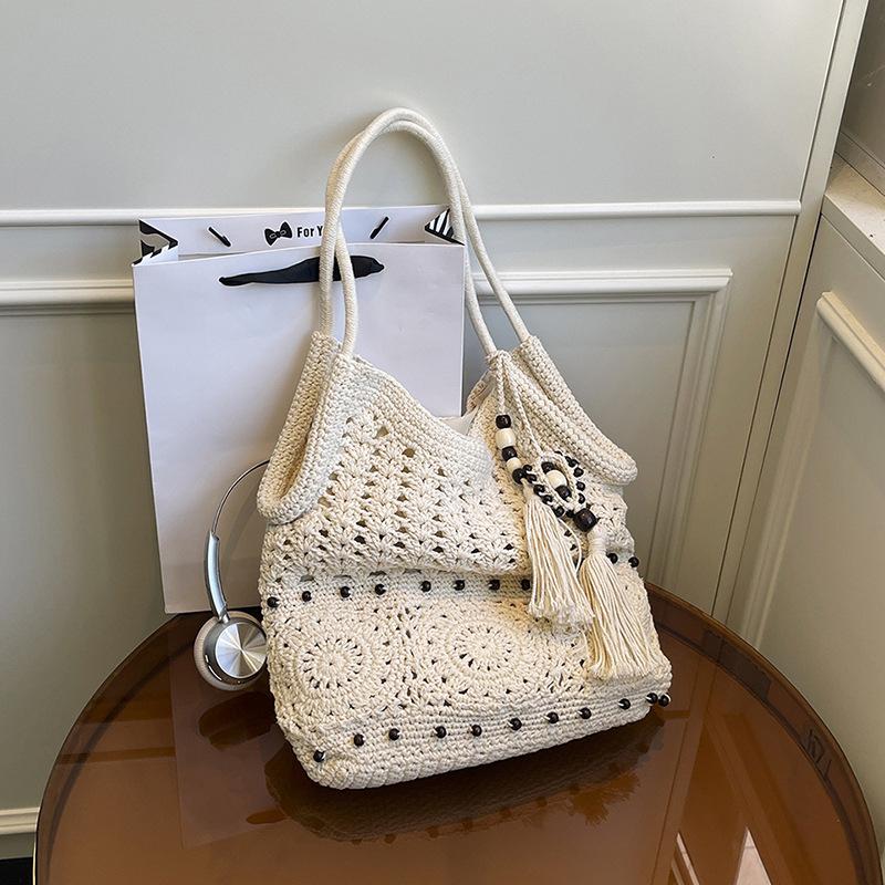 

Tassel woven bag tote bag women s summer new niche hollow cotton bag casual shoulder bag handbag покинуть белый