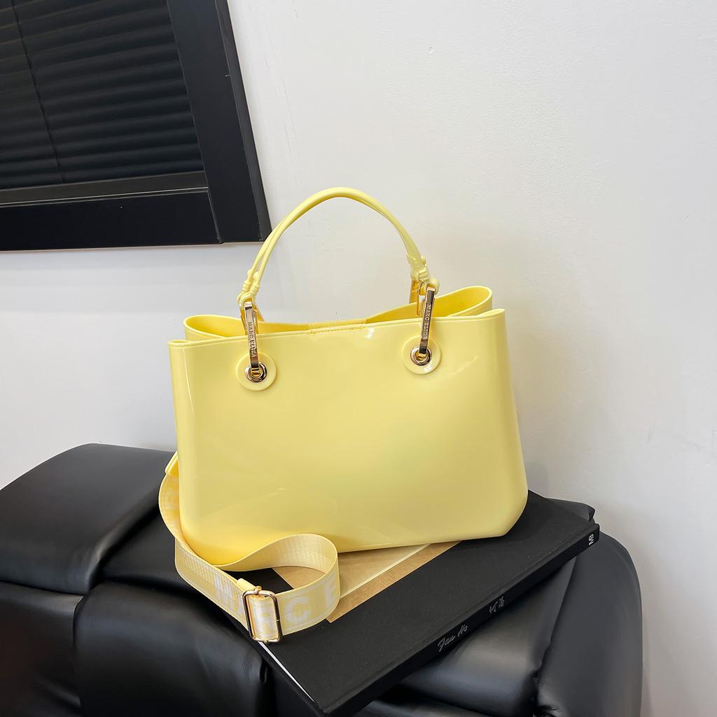 New fashion high-end sense solid color pvc commuter bag portable shoulder messenger temperament women's bag