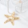 Collier tendance 2024 avec pendentif étoile de mer en or pour femme, bijoux de style bohème pour les fêtes de vacances d'été