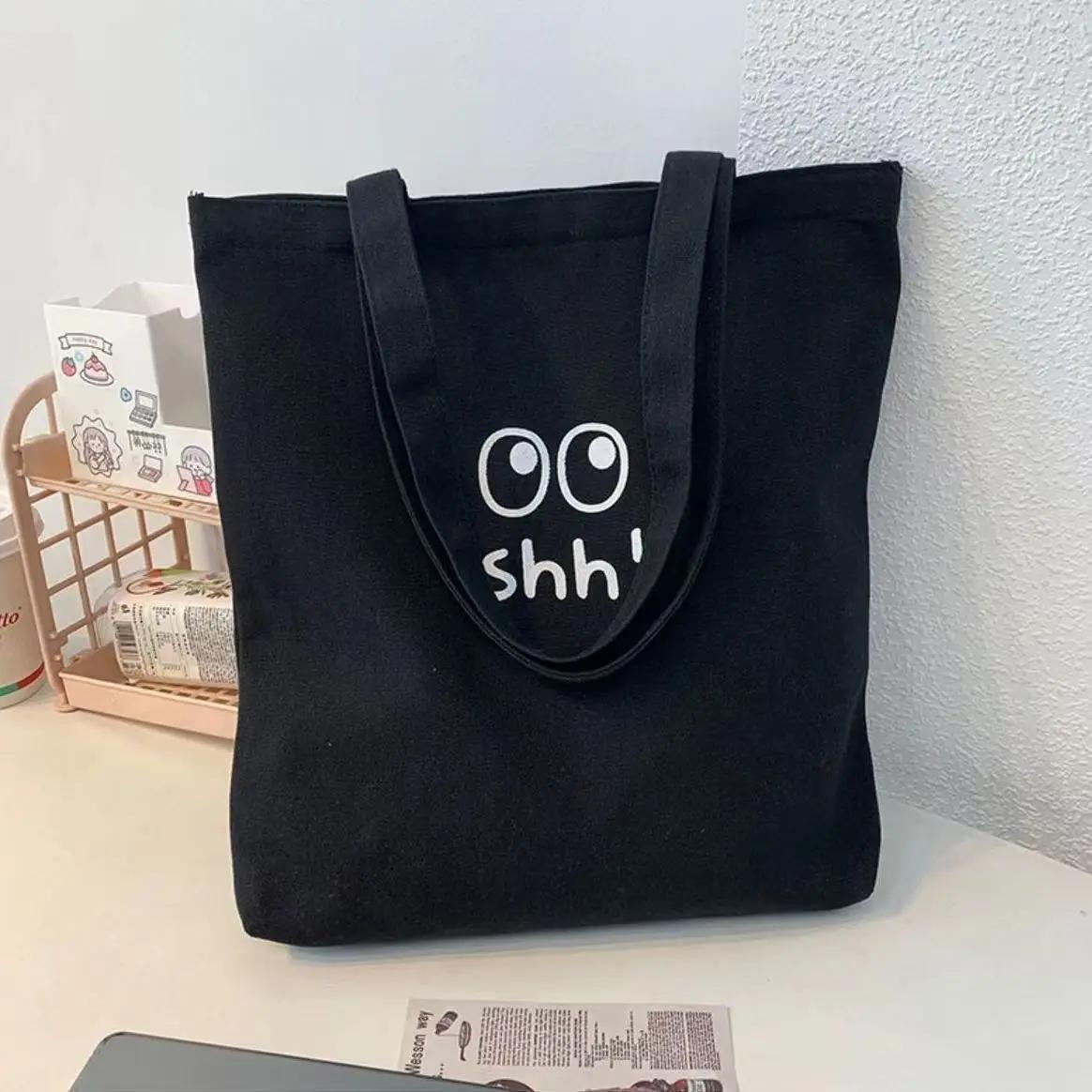 

New lazy style ins versatile, casual simple solid color carto big eyes shh! Printed hand carry shoulder bag envirmentally fr