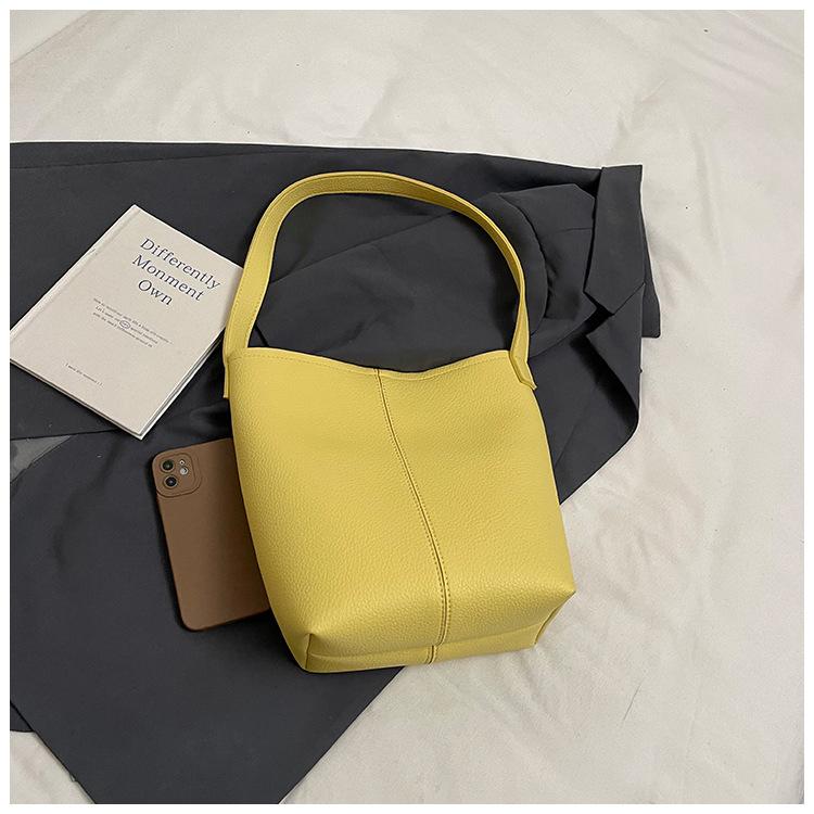 

Оптовая горячая распродажа однотонная сумка-ведро с текстурой личи, передовое чувство, универсальная, для поездок на работу, многоцветная наплечная сумка для женщин