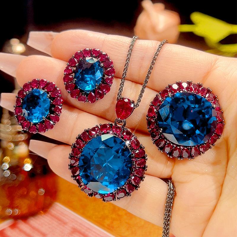 

Luxury Oval Blue Topaz Ruby Red Crystal Halo Jewelry Adjustable Ring Necklace Earrings Party Wedding Bridal Jewelry for Women One size
