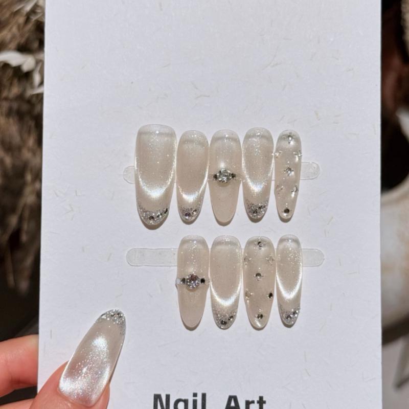 10Pcs Handmade Nude White Cat Eye Fake Nails with Silver Glitter French Tips & Rhinestone Accents XS