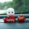 Creative Little Monk Maitreya Buddha Car Ornament: Cute, Shaking Head Resin Doll for Car Interior Decoration and Safety.
