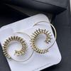 Handgefertigte hochwertige Tribal-Spiralohrringe aus Messing, einzigartiger Boho-Schmuck mit kompliziertem Spiraldesign, ethnische Statement-Ohrringe für einen mutigen Look