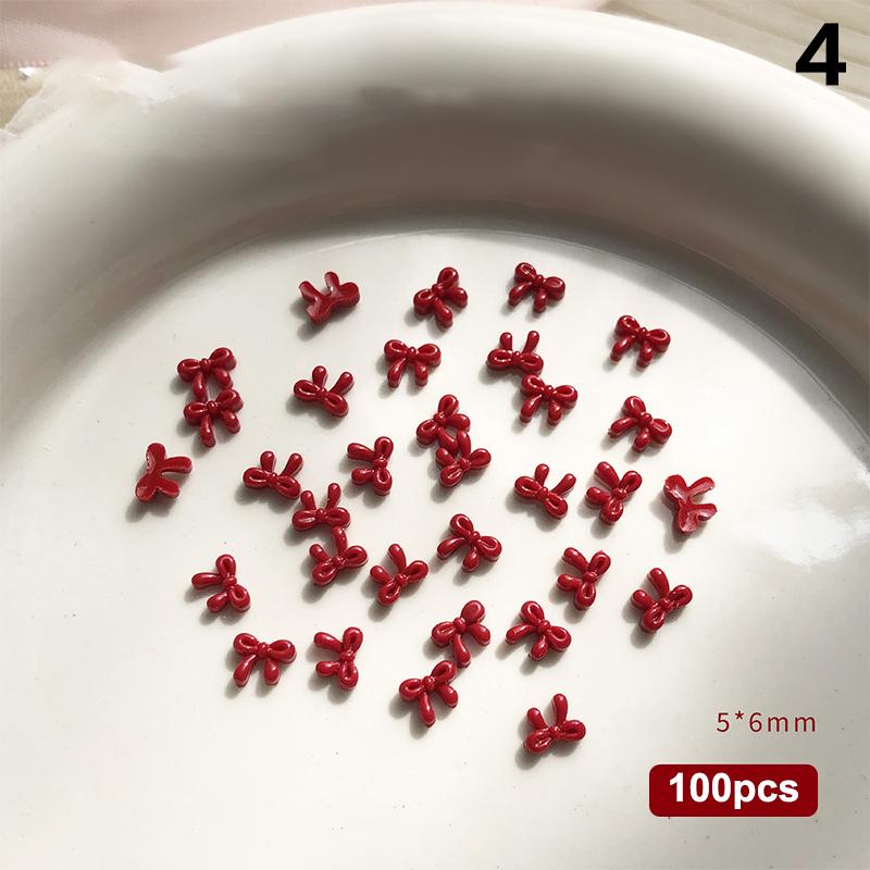 100 Stück 3D Nail Art Rote Schleifen Anhänger Kawaii Harz Zubehör für Maniküre Dekorationen 10 Stück pro Set Nail Art Zubehör