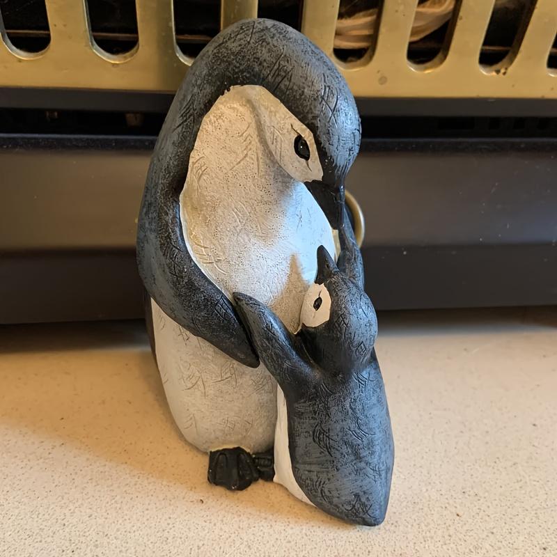 A Set of Two Resin Statues Featuring a Mother And Penguin Showcasing a Creative Family Theme These Can Serve As Decorative Pieces for Home