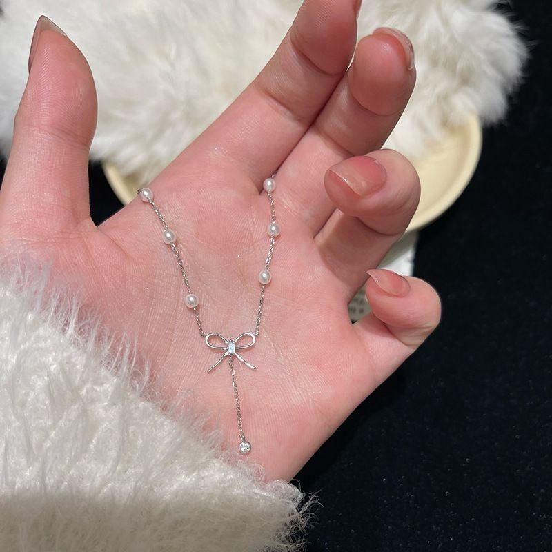 Bow Necklace Female Summer Niche Design Sense Temperament Imitation Pearl Fringed Collarbone Chain Inlaid Zircon Chain