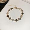 Rhinestone Clover Flower Bracelet: Elegant Retro Design with a Light, Luxurious Touch