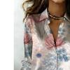 The lady's long-sleeved button-down shirt features a printed and delicate floral design, making it perfect for both romantic and casual styles.