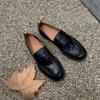 The New Style of Shoes Features A Retro Thick Heel and A Pair of Leather Shoes
