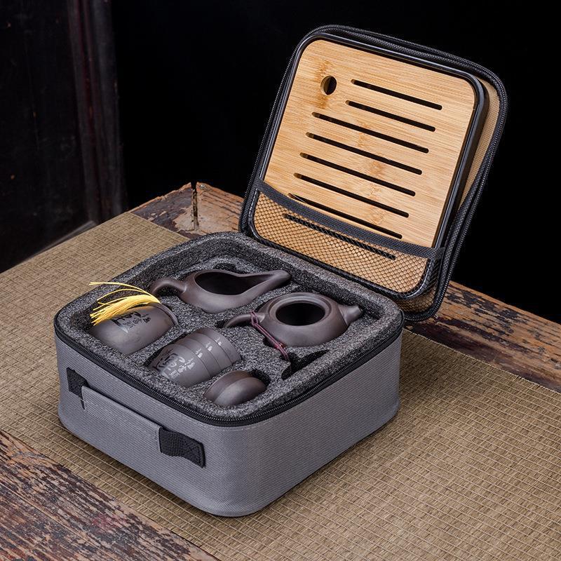 Creative Zisha Travel Kung Fu Tea Set: Portable Storage with One Pot and Four Cups - Ideal for Company Events and Gifts, Customizable with Logo.