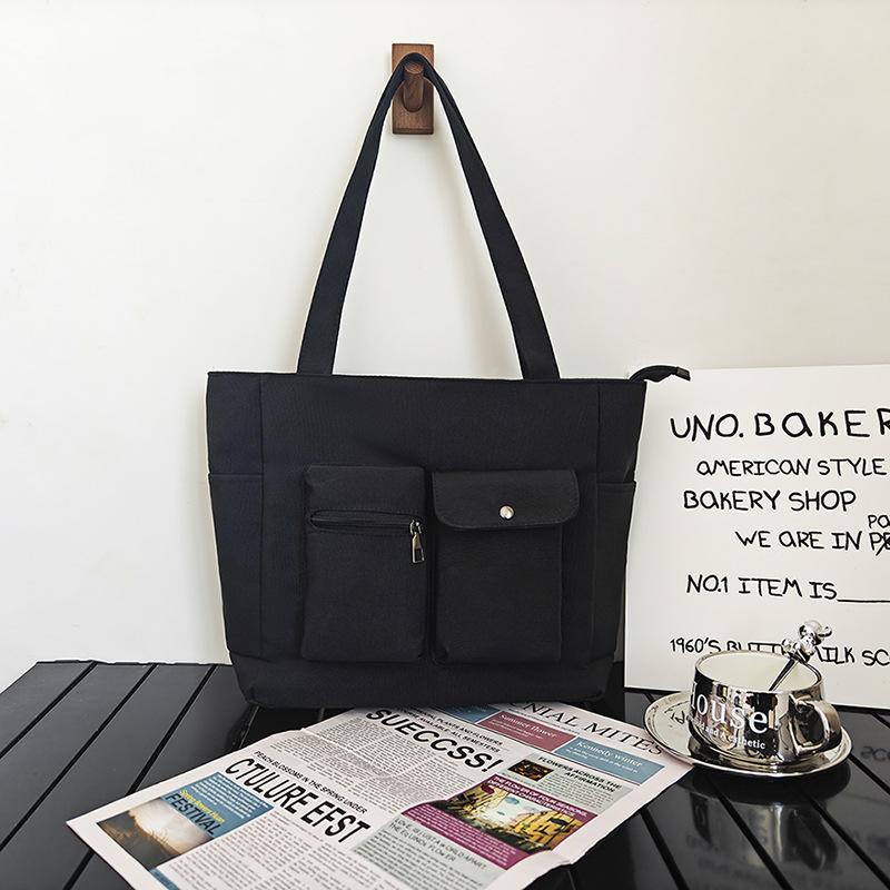 

Large capacity canvas bag women s 2025 spring new fashion casual shoulder women s bag double pocket commuter tote bag