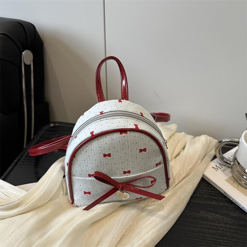 Schoolbag Korean version of college style women's shoulder bag 1011 new summer fashion bow small backpack shopping commuter bag